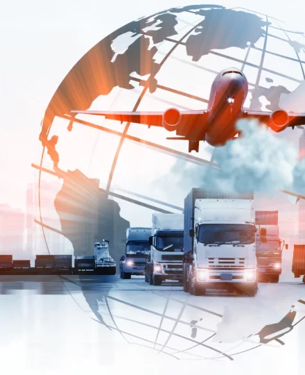 Global logistics illustration showing a fleet of freight trucks driving forward beneath a flying cargo airplane, overlaid with a translucent world map and globe grid, symbolizing international road and air transportation networks.